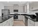 Modern kitchen with stainless steel appliances and kitchen island at 1174 Seaside Mist Trl, Kissimmee, FL 34747