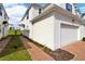 Attached garage with brick pathway at 1174 Seaside Mist Trl, Kissimmee, FL 34747
