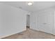 Simple bedroom with double doors to closet and hallway access at 1174 Seaside Mist Trl, Kissimmee, FL 34747
