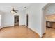 Bright dining room with wood flooring, a view into the living room, and access to the kitchen at 3330 La Salle Ave, Saint Cloud, FL 34772