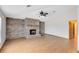 Spacious living room featuring a brick fireplace and wood-look flooring at 3330 La Salle Ave, Saint Cloud, FL 34772