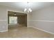Dining room with view into living room and sliding glass doors at 404 Banyon Tree Cir # 200, Maitland, FL 32751