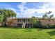 Brick building with a grassy lawn and stairway access to units at 404 Banyon Tree Cir # 200, Maitland, FL 32751