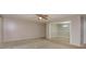 Living room with carpet, ceiling fan, and view into dining area at 404 Banyon Tree Cir # 200, Maitland, FL 32751
