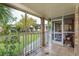 Screened porch with view of backyard and trees at 404 Banyon Tree Cir # 200, Maitland, FL 32751