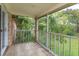 Relaxing screened porch overlooking a lush green backyard at 404 Banyon Tree Cir # 200, Maitland, FL 32751