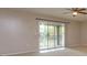 Living room with sliding glass doors leading to a balcony at 404 Banyon Tree Cir # 200, Maitland, FL 32751