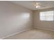 Simple bedroom with ceiling fan and window at 404 Banyon Tree Cir # 200, Maitland, FL 32751