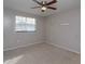 Simple bedroom with ceiling fan and window at 404 Banyon Tree Cir # 200, Maitland, FL 32751