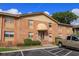 Brick building exterior with entrance and parking at 404 Banyon Tree Cir # 200, Maitland, FL 32751