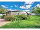 Gray house exterior with landscaping and brick path at 4150 Citrus St, Kissimmee, FL 34746