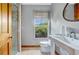 Simple bathroom with a pedestal sink, toilet, and shower at 4150 Citrus St, Kissimmee, FL 34746