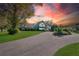 A-frame house exterior at sunset, long driveway at 4150 Citrus St, Kissimmee, FL 34746
