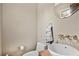 Small bathroom with pedestal sink and toilet at 4150 Citrus St, Kissimmee, FL 34746