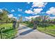 Gated entrance to the property with long driveway at 4150 Citrus St, Kissimmee, FL 34746
