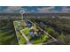 Aerial view of property showing house, pond, and grounds at 4150 Citrus St, Kissimmee, FL 34746