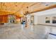 Large living room with stone fireplace and tile flooring at 4150 Citrus St, Kissimmee, FL 34746