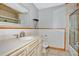 Clean bathroom with a vanity, toilet, shower, and tiled floors at 4150 Citrus St, Kissimmee, FL 34746