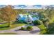 Aerial view of a large house with a pond at 4150 Citrus St, Kissimmee, FL 34746