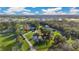 Aerial view of a house with a pond and large yard at 4150 Citrus St, Kissimmee, FL 34746
