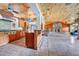 Spacious kitchen with island, wood cabinets, and tile flooring at 4150 Citrus St, Kissimmee, FL 34746