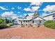 Large brick patio with built-in outdoor kitchen at 4150 Citrus St, Kissimmee, FL 34746