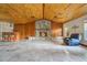Spacious living room with stone fireplace and wood ceiling at 4150 Citrus St, Kissimmee, FL 34746