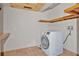 Laundry room with washer, dryer, and shelving at 4150 Citrus St, Kissimmee, FL 34746