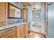 Bathroom features wood cabinets and granite countertop at 4150 Citrus St, Kissimmee, FL 34746