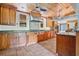 Spacious kitchen featuring wood cabinets, granite countertops, and a Wolf range at 4150 Citrus St, Kissimmee, FL 34746
