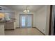 Kitchen with tile floors and double doors leading to patio at 502 Parson Brown Way, Longwood, FL 32750