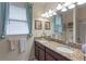 Bathroom with double vanity and granite countertops at 5307 Cortland Dr, Davenport, FL 33837
