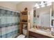 Small bathroom with shower, toilet and granite countertop at 5307 Cortland Dr, Davenport, FL 33837