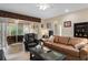 Comfortable living room featuring leather furniture and sliding glass doors at 5307 Cortland Dr, Davenport, FL 33837