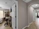 Bright hallway with tile flooring, access to bedrooms, and neutral wall paint at 7621 Brightwater Pl, Oviedo, FL 32765