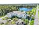 Aerial view of building and surrounding area with lake at 770 Siena Palm Dr # 305, Celebration, FL 34747