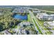 Aerial view of a community with a lake, showing the property's location and surrounding area at 770 Siena Palm Dr # 305, Celebration, FL 34747
