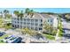Three-story building with white siding, balconies, and palm trees at 770 Siena Palm Dr # 305, Celebration, FL 34747
