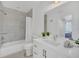 Clean bathroom with a white vanity and marble shower at 770 Siena Palm Dr # 305, Celebration, FL 34747