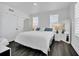 Spacious bedroom with king-size bed and dark hardwood floors at 770 Siena Palm Dr # 305, Celebration, FL 34747