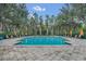 Inviting community pool with lounge chairs and palm trees at 770 Siena Palm Dr # 305, Celebration, FL 34747