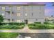 Building exterior with landscaping and walkway at 770 Siena Palm Dr # 305, Celebration, FL 34747