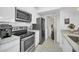Modern kitchen with stainless steel appliances and white cabinets at 770 Siena Palm Dr # 305, Celebration, FL 34747