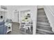 Bright living area with gray sofas and a view from the balcony at 770 Siena Palm Dr # 305, Celebration, FL 34747