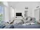 Relaxing living room featuring a large TV and comfortable seating at 770 Siena Palm Dr # 305, Celebration, FL 34747