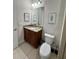 Bathroom with granite vanity and toilet at 7763 Westland Dr, Kissimmee, FL 34747