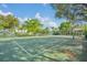 Well-maintained tennis court surrounded by lush landscaping at 8919 Legacy Ct # 303, Kissimmee, FL 34747