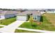 One story house with a green exterior, two car garage, and manicured lawn at 1117 Star Ruby Ln, Winter Haven, FL 33880