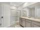Modern bathroom with double vanity and walk-in shower at 1117 Star Ruby Ln, Winter Haven, FL 33880