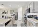 Modern kitchen with stainless steel appliances and an island at 1117 Star Ruby Ln, Winter Haven, FL 33880